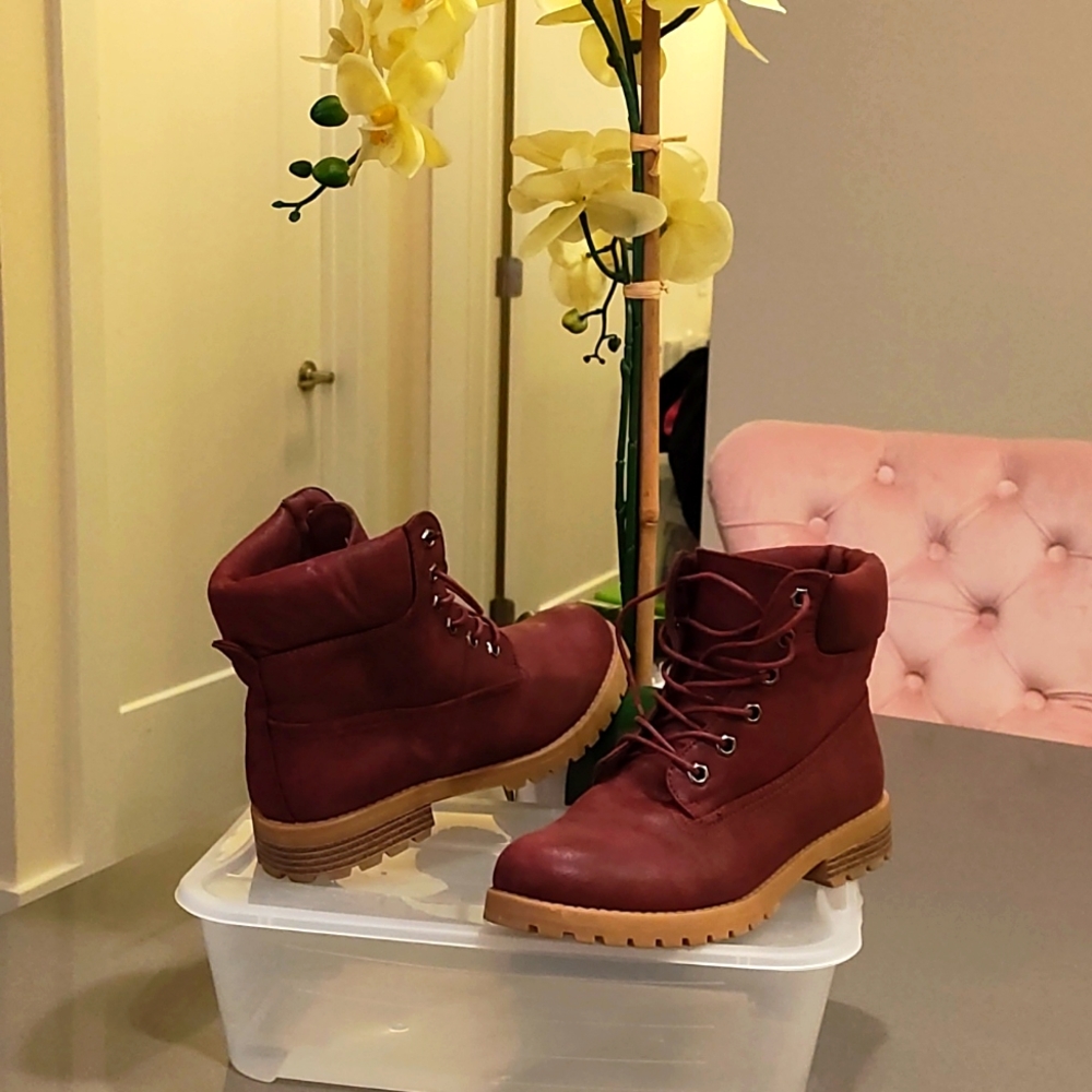 Burgundy lace up boots.